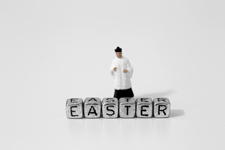 Miniature scale model priest with Easter on beadsの写真素材
