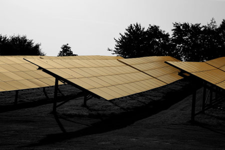 Solar panels farm in a field in the countryside with early morning sunshine.   Abstract with...
