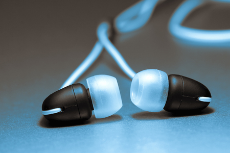 Pair of wired in ear earphones with colour toningの写真素材