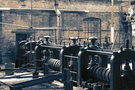 Victorian machine workshop factory with metal press machines with colour toningの写真素材
