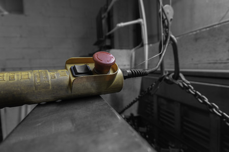 Control for an indoor crane hoist in a factory workshop with selective colourの写真素材