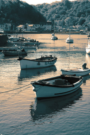 Fishing boat moored in Lower Fishguard harbour in Pembrokeshire in Wales.  With colour toning