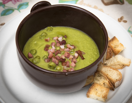 Pea soup with croutons and baconの写真素材