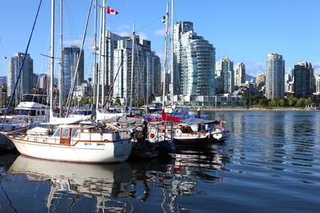 Vancouver BC.,skyline at False Creek and moored sailboats.のeditorial素材