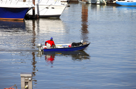Fisherman and his companion heading out to fish, Portland OR 
