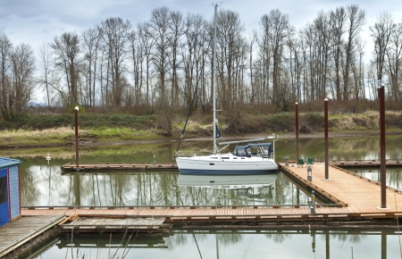 White sailboat moored in a river Suvie Island, Oregon の写真素材