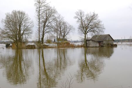 Flood in Spring surrounding a countryside house の写真素材