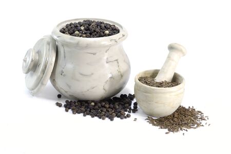 Pepper and Cumin in little bowls on on white backgroundの写真素材