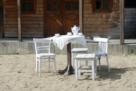 White chair and table in wild west willageの写真素材