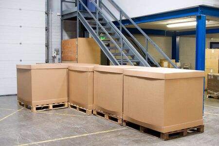 pallets with cartons in warehouseの写真素材