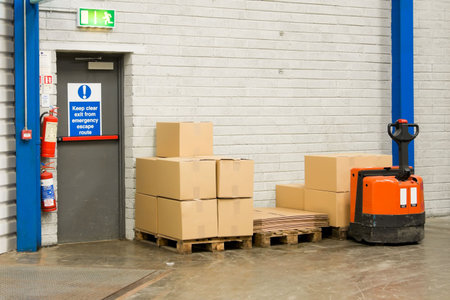 Fork-lift In Warehouse And Pallets With Cartonsの写真素材