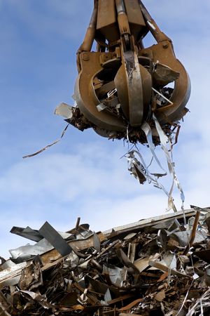 crane grabber loading a metal garbageの写真素材