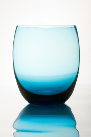 empty glass  reflected on the surface, isolated on whiteの写真素材