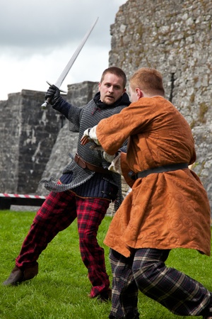 ATHENRY, IRELAND - AUGUST 21: Lucas and John from Eireann Edge displays mediavel combat at annual National Walled Towns Day  on August 21, 2011 in Athenry, Ireland.のeditorial素材