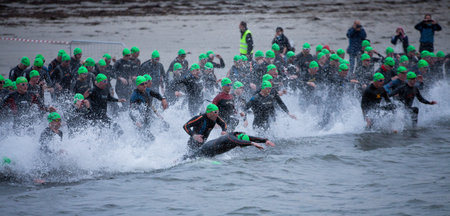 GALWAY - SEPTEMBER 4: Athletes start at first Edition of Galway Iron Man Triathlon on September 4, 2011 in Galway, Irelandのeditorial素材