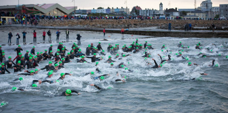 GALWAY - SEPTEMBER 4: Athletes start at first Edition of Galway Iron Man Triathlon on September 4, 2011 in Galway, Irelandのeditorial素材
