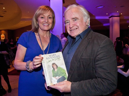 BALLINASLOE - DECEMBER 5: Mary Kennedy, RTE, sign her book to Padraic Connolly at official Launch of Heather & Earth by C Spa in Carlton Shearwater Hotel on December 5, 2011 in Ballinasloe, Ireland.のeditorial素材
