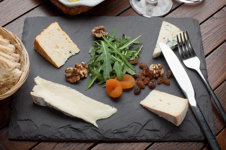 French   Irish Cheese Platter with nuts and dried apricotの写真素材