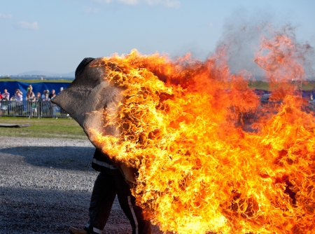 running stunt man on fire at the showの写真素材