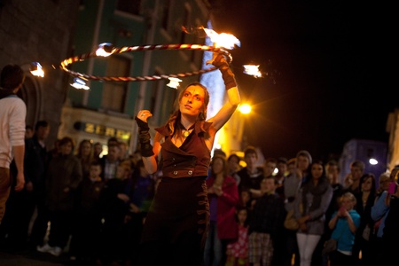 GALWAY, IRELAND - JULY 5: Unidentified Fire juggler performs on streets of Galway  during Volvo Ocean Race 2011-12 Festival, on July 5, 2012 in Galway, Ireland.のeditorial素材