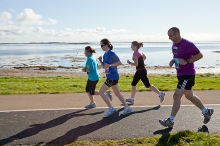 GALWAY, IRELAND - OCTOBER 6: Unidentified athletes compete during annual Galway Bay Half Marathon and 10K, on October 6, 2012 in Galway, Ireland.のeditorial素材
