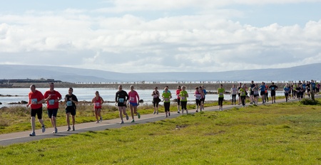 GALWAY, IRELAND - OCTOBER 6: Unidentified athletes compete during annual Galway Bay Half Marathon and 10K, on October 6, 2012 in Galway, Ireland.のeditorial素材