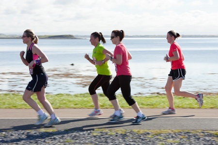GALWAY, IRELAND - OCTOBER 6: Unidentified athletes compete during annual Galway Bay Half Marathon and 10K, on October 6, 2012 in Galway, Ireland.のeditorial素材