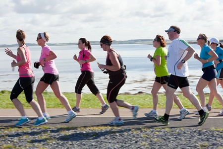 GALWAY, IRELAND - OCTOBER 6: Unidentified athletes compete during annual Galway Bay Half Marathon and 10K, on October 6, 2012 in Galway, Ireland.のeditorial素材