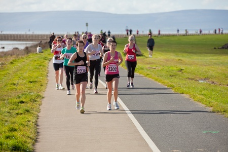 GALWAY, IRELAND - OCTOBER 6: Unidentified athletes compete during annual Galway Bay Half Marathon and 10K, on October 6, 2012 in Galway, Ireland.のeditorial素材