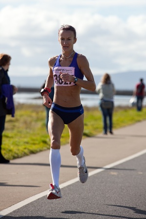 GALWAY, IRELAND - OCTOBER 6: Pauline Curley (3827), lead female, compete during annual Galway Bay Half Marathon and 10K, on October 6, 2012 in Galway, Ireland.のeditorial素材