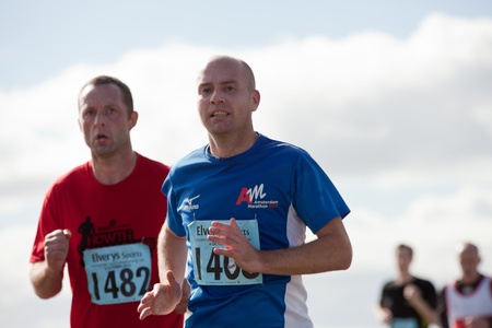 GALWAY, IRELAND - OCTOBER 6: Unidentified athletes compete during annual Galway Bay Half Marathon and 10K, on October 6, 2012 in Galway, Ireland.のeditorial素材