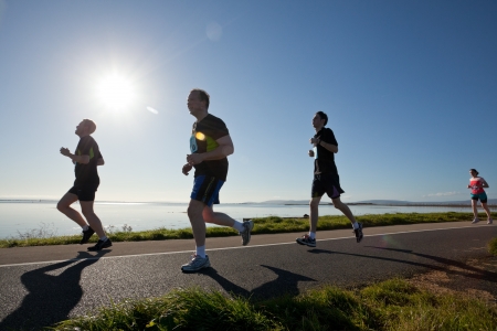 GALWAY, IRELAND - OCTOBER 6: Unidentified athletes compete during annual Galway Bay Half Marathon and 10K, on October 6, 2012 in Galway, Ireland.のeditorial素材