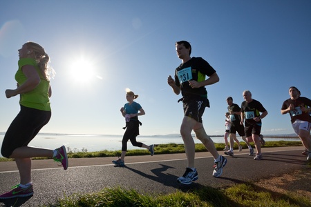 GALWAY, IRELAND - OCTOBER 6: Unidentified athletes compete during annual Galway Bay Half Marathon and 10K, on October 6, 2012 in Galway, Ireland.のeditorial素材