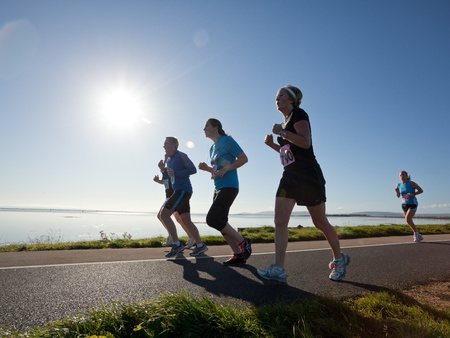GALWAY, IRELAND - OCTOBER 6: Unidentified athletes compete during annual Galway Bay Half Marathon and 10K, on October 6, 2012 in Galway, Ireland.のeditorial素材