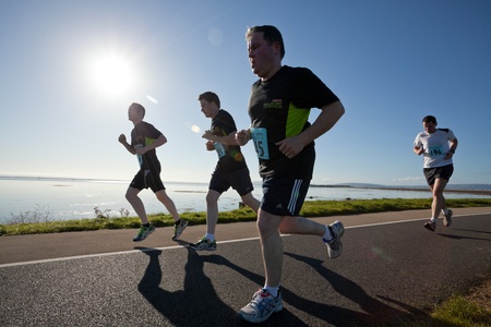 GALWAY, IRELAND - OCTOBER 6: Unidentified athletes compete during annual Galway Bay Half Marathon and 10K, on October 6, 2012 in Galway, Ireland.のeditorial素材
