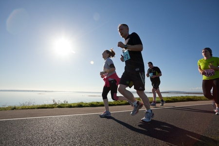 GALWAY, IRELAND - OCTOBER 6: Unidentified athletes compete during annual Galway Bay Half Marathon and 10K, on October 6, 2012 in Galway, Ireland.のeditorial素材