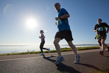 GALWAY, IRELAND - OCTOBER 6: Unidentified athletes compete during annual Galway Bay Half Marathon and 10K, on October 6, 2012 in Galway, Ireland.のeditorial素材