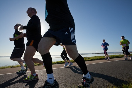 GALWAY, IRELAND - OCTOBER 6: Unidentified athletes compete during annual Galway Bay Half Marathon and 10K, on October 6, 2012 in Galway, Ireland.のeditorial素材