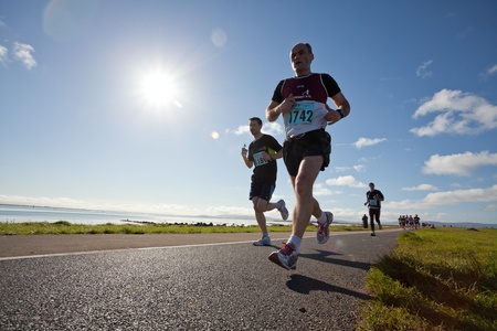 GALWAY, IRELAND - OCTOBER 6: Mark Breen (1742) and other athletes compete during annual Galway Bay Half Marathon and 10K, on October 6, 2012 in Galway, Ireland.のeditorial素材