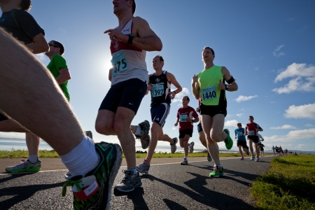 GALWAY, IRELAND - OCTOBER 6: Unidentified athletes compete during annual Galway Bay Half Marathon and 10K, on October 6, 2012 in Galway, Ireland.のeditorial素材