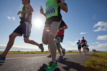 GALWAY, IRELAND - OCTOBER 6: Unidentified athletes compete during annual Galway Bay Half Marathon and 10K, on October 6, 2012 in Galway, Ireland.のeditorial素材