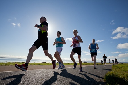 GALWAY, IRELAND - OCTOBER 6: Helen Corbett (3591) and other athletes compete during annual Galway Bay Half Marathon and 10K, on October 6, 2012 in Galway, Ireland.のeditorial素材