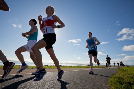 GALWAY, IRELAND - OCTOBER 6: Helen Corbett (3591) and other athletes compete during annual Galway Bay Half Marathon and 10K, on October 6, 2012 in Galway, Ireland.のeditorial素材