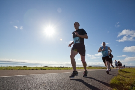 GALWAY, IRELAND - OCTOBER 6: Bernard McGee and other athletes compete during annual Galway Bay Half Marathon and 10K, on October 6, 2012 in Galway, Ireland.のeditorial素材