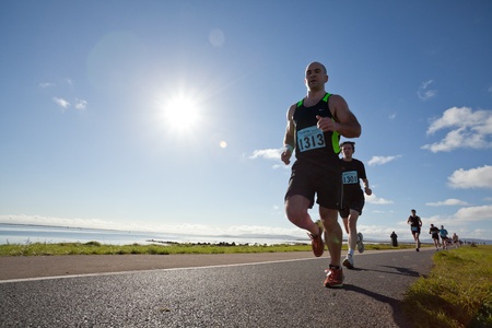 GALWAY, IRELAND - OCTOBER 6: Unidentified athletes compete during annual Galway Bay Half Marathon and 10K, on October 6, 2012 in Galway, Ireland.のeditorial素材