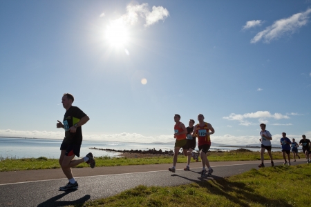 GALWAY, IRELAND - OCTOBER 6: Unidentified athletes compete during annual Galway Bay Half Marathon and 10K, on October 6, 2012 in Galway, Ireland.のeditorial素材