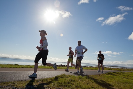 GALWAY, IRELAND - OCTOBER 6: Unidentified athletes compete during annual Galway Bay Half Marathon and 10K, on October 6, 2012 in Galway, Ireland.のeditorial素材