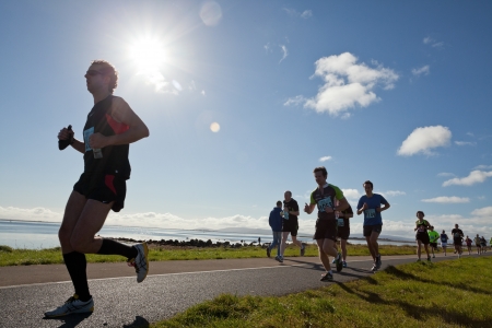 GALWAY, IRELAND - OCTOBER 6: Unidentified athletes compete during annual Galway Bay Half Marathon and 10K, on October 6, 2012 in Galway, Ireland.のeditorial素材