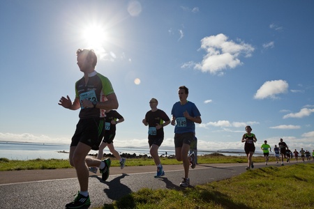 GALWAY, IRELAND - OCTOBER 6: Unidentified athletes compete during annual Galway Bay Half Marathon and 10K, on October 6, 2012 in Galway, Ireland.のeditorial素材