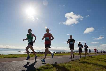 GALWAY, IRELAND - OCTOBER 6: Unidentified athletes compete during annual Galway Bay Half Marathon and 10K, on October 6, 2012 in Galway, Ireland.のeditorial素材